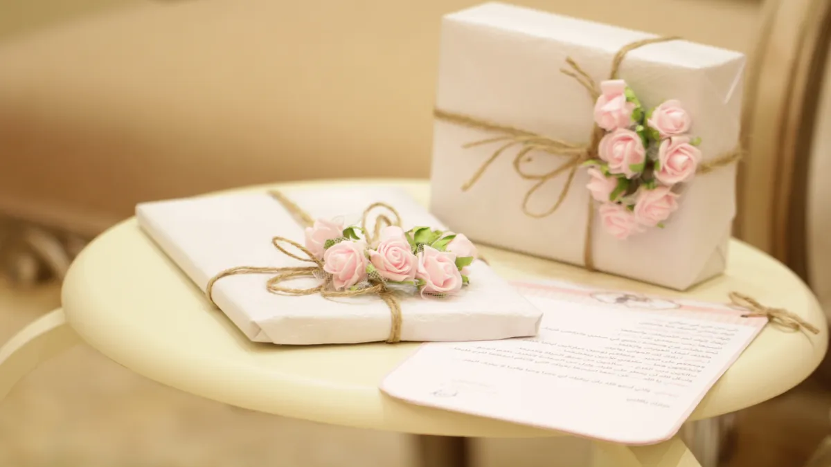 Two wedding gifts sit on a table.