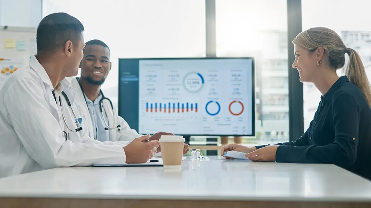 Doctors talking at a table together