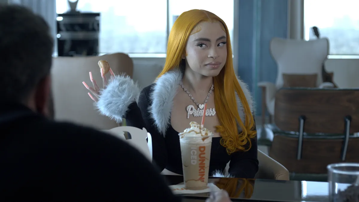 Rapper Ice Spice appears with her namesake Munchkins Drink in a Dunkin' ad