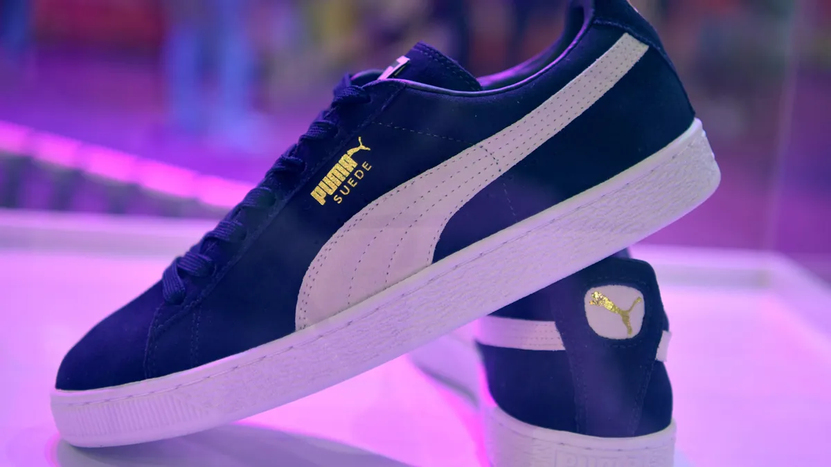 Puma sneakers are shown on display.