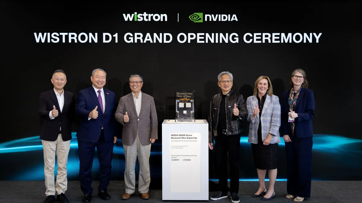 Winstron executives stand at opening ceremony of D1 plant