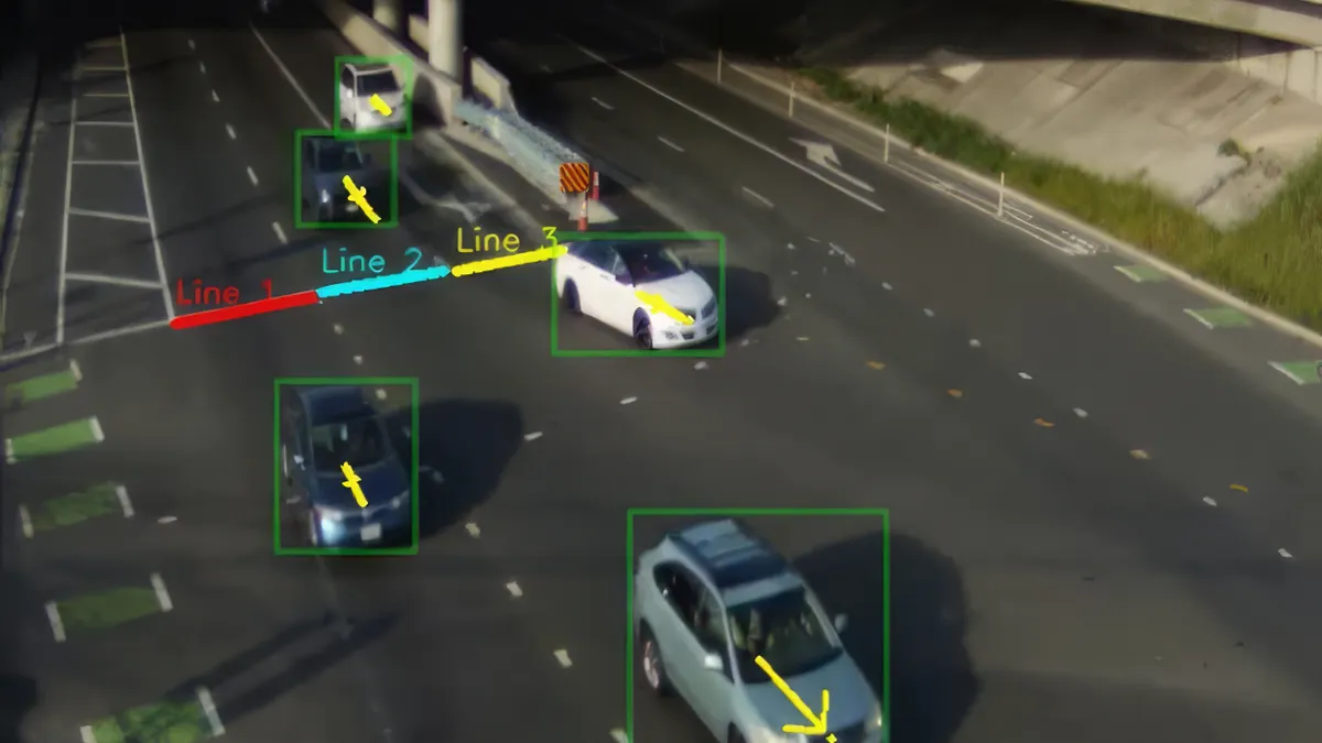 Screenshot of a camera looking down at vehicles on a roadway with boxes demarcating each car.