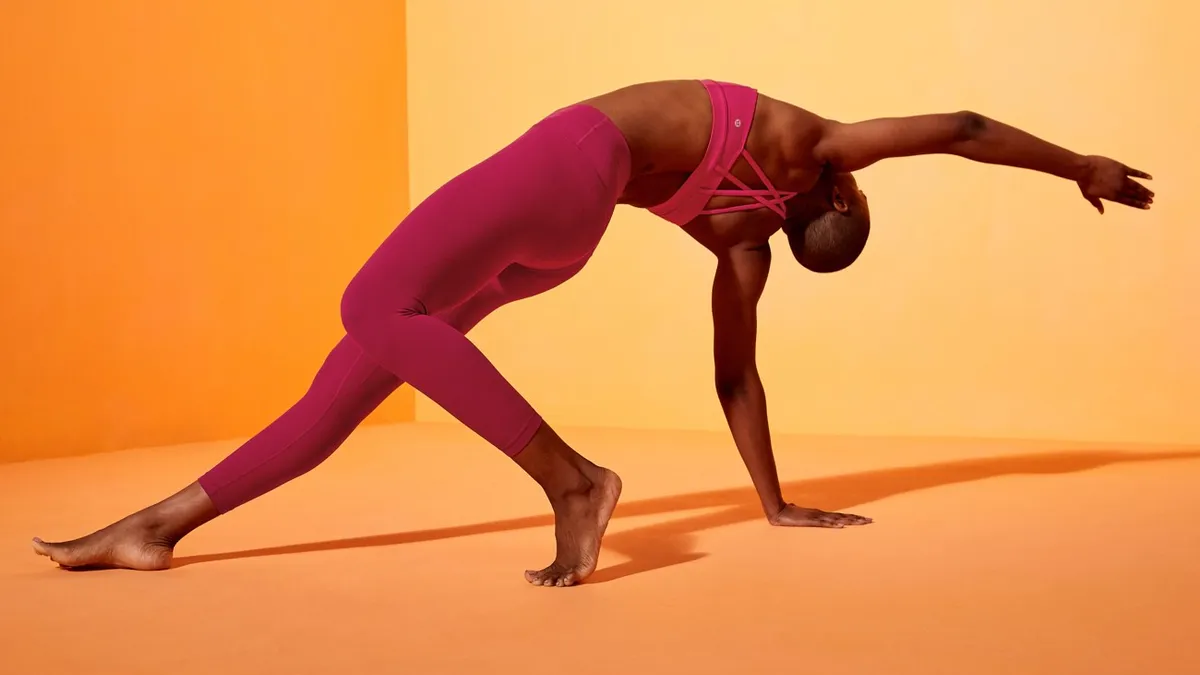 A person bends over backwards in a yoga pose.