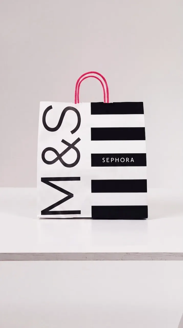 A shopping bag that says M&amp;S and Sephora.