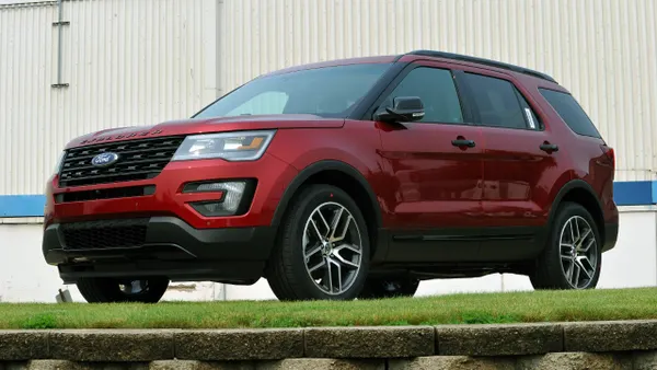 A red 2016 Ford Explorer parked outdoors.
