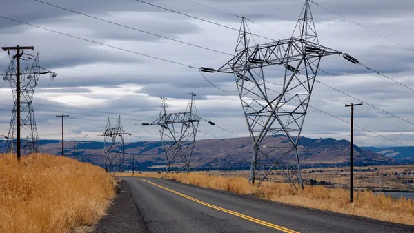 Electric transmission lines crossing a road.