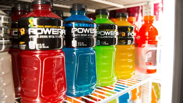 Various flavors of Powerade sports drink sit on a shelf