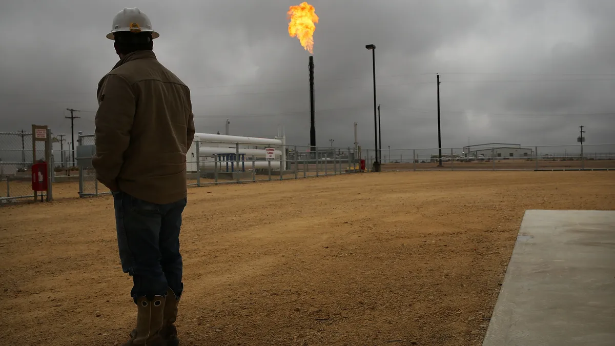 Image shows natural gas being flared at Apache Corporations operations at the Deadwood natural gas plant in the Permian Basin in Texas.