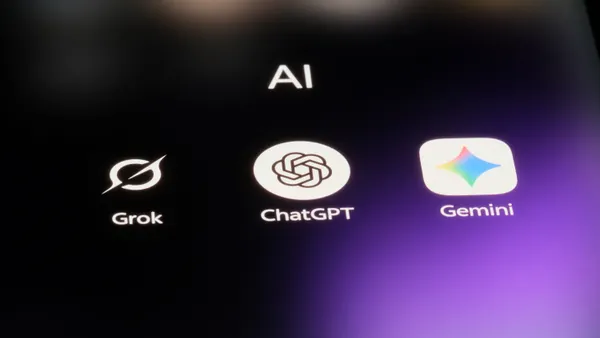 The icons for generative AI applications Grok, ChatGPT and Gemini are pictured on a purple screen.