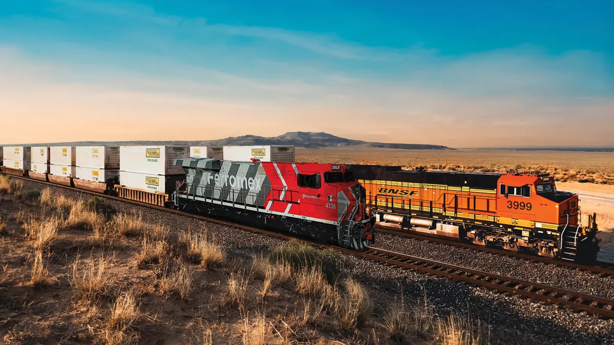A Ferromex and BNSF rail train transport JB Hunt containers.
