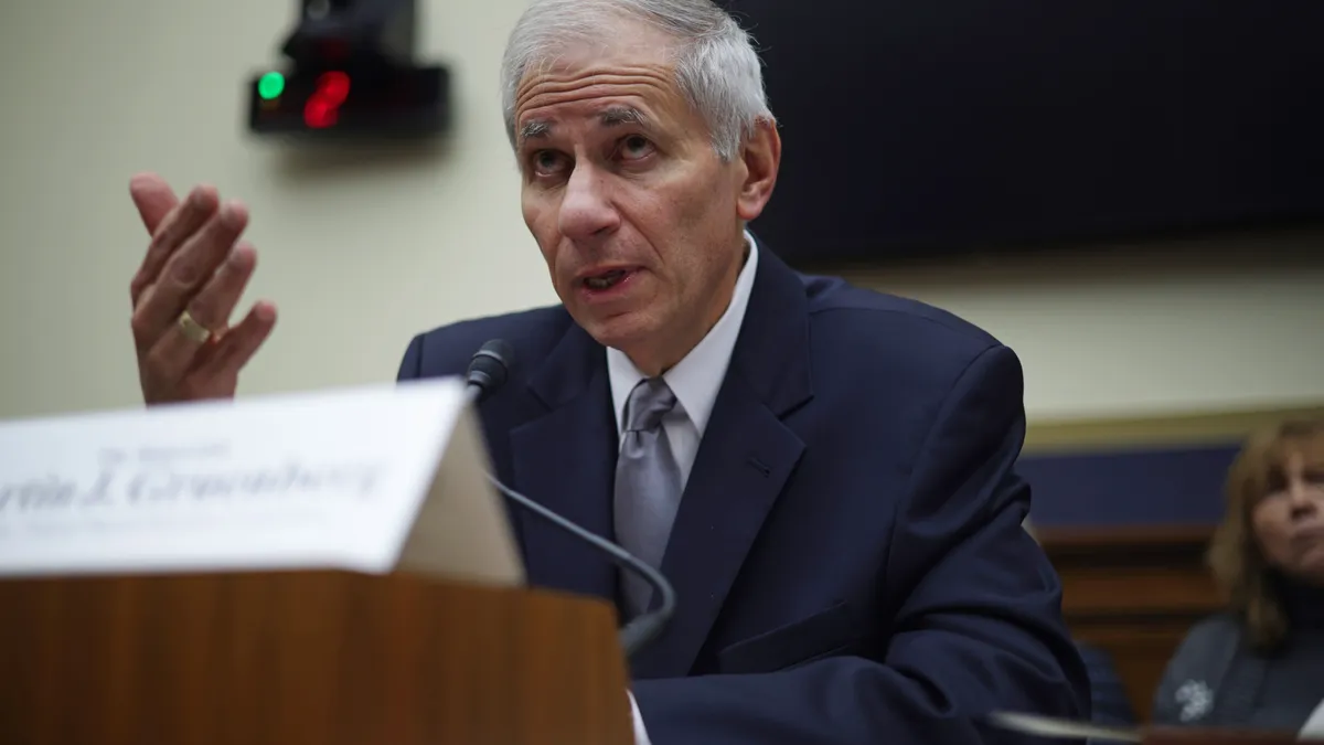 Martin Gruenberg, who leads the Federal Deposit Insurance Corp., talks to legislators during a Congressional hearing.