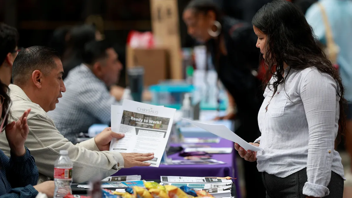 One person shares a flyer that says "Ready to Work?" with another person.