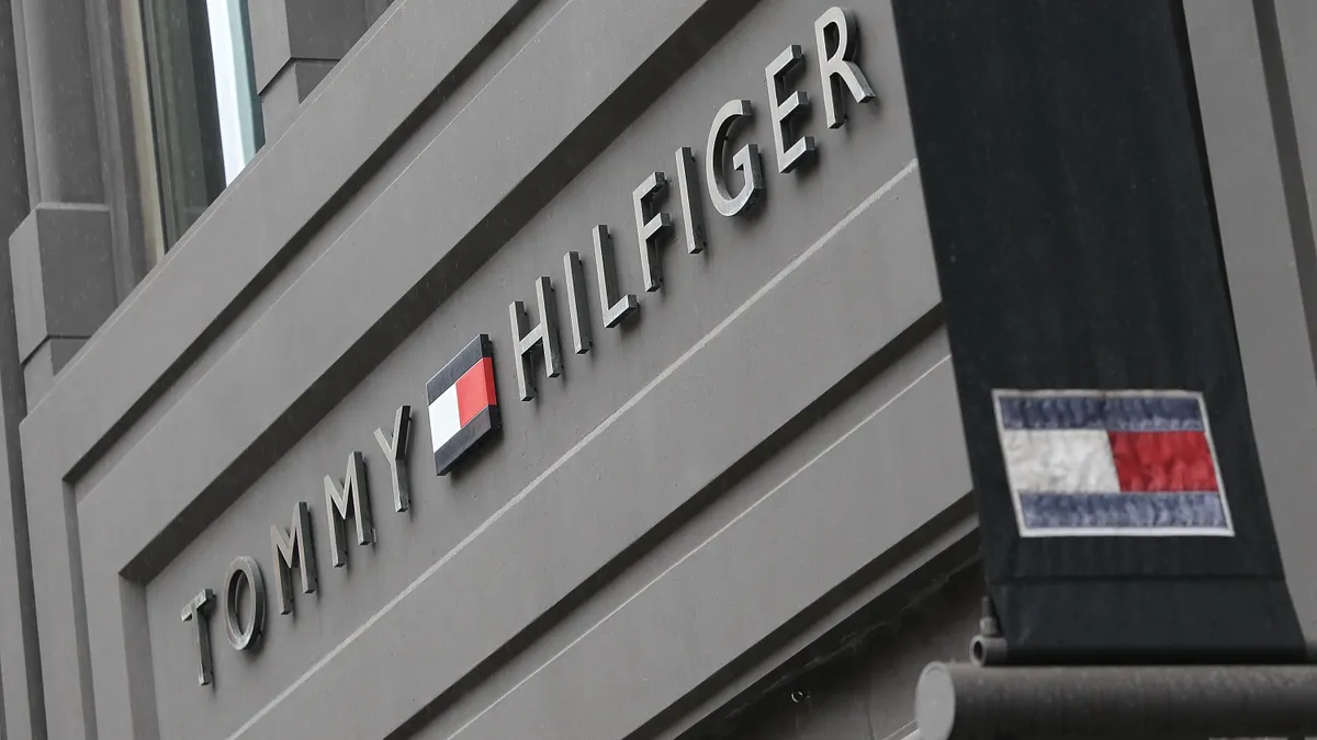 A Tommy Hilfiger sign is pictured on a storefront.