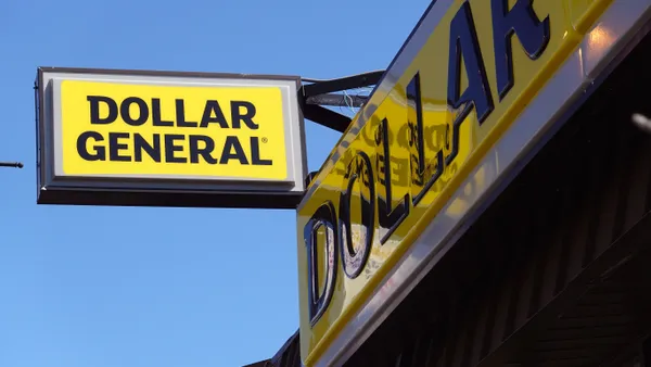 A Dollar General sign as seen from below.