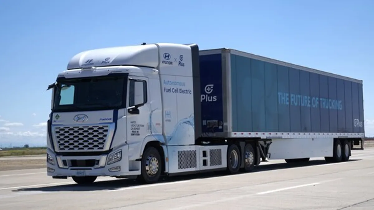 An electric autonomous truck on a roadway.