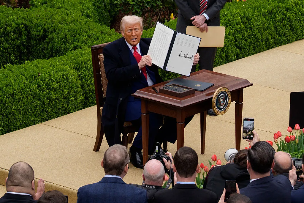 U.S. President Donald Trump holds his executive order imposing tariffs.
