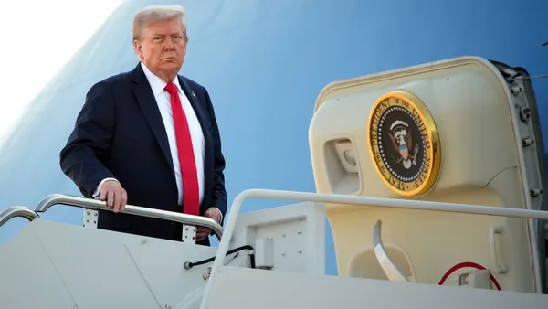 President Donald Trump boards Air Force One on Aug. 15, 2025, at Joint Base Andrews, Maryland.