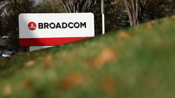 A sign is posted in front of a Broadcom office on December 12,