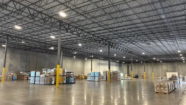 One of Roadtex's new facilities, located in Greenville, South Carolina, showing pallets of items scattered in a vast warehouse.