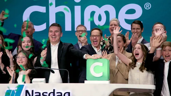 A crowd celebrates during Chime's initial public offering at the Nasdaq MarketSite.