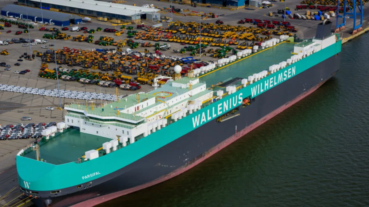 An ocean vessel takes berth at an ocean terminal,