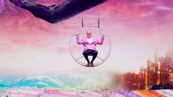 Mark Marshall descends from the rafters at NBCUniversal's upfronts presentation on May 12, 2025.