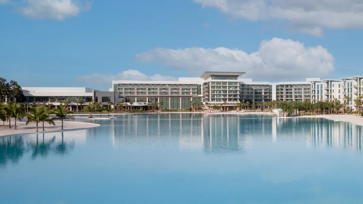 The exterior of Conrad Orlando as seen from across a lagoon.