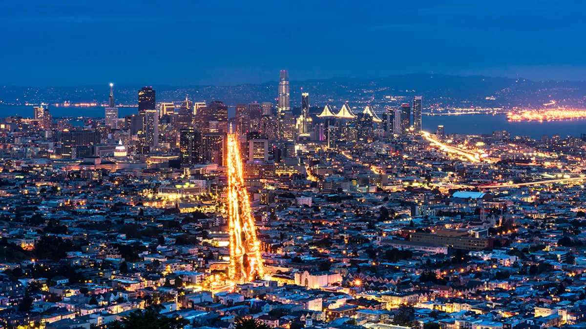 View of San Francisco from above. Long exposure at night. dramatic sky, lights and glitters