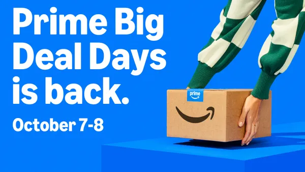 Person holding an Amazon Prime box.
