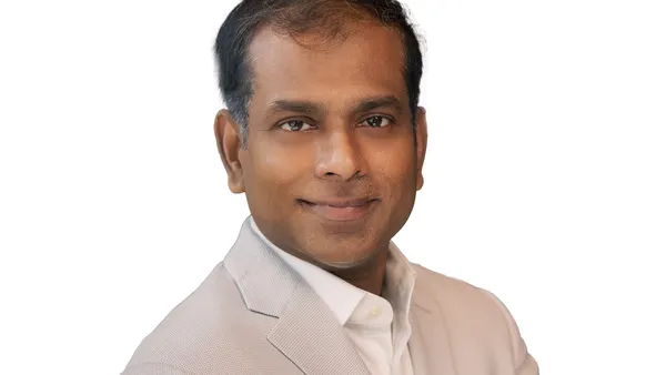 a headshot of executive Naveen Manga