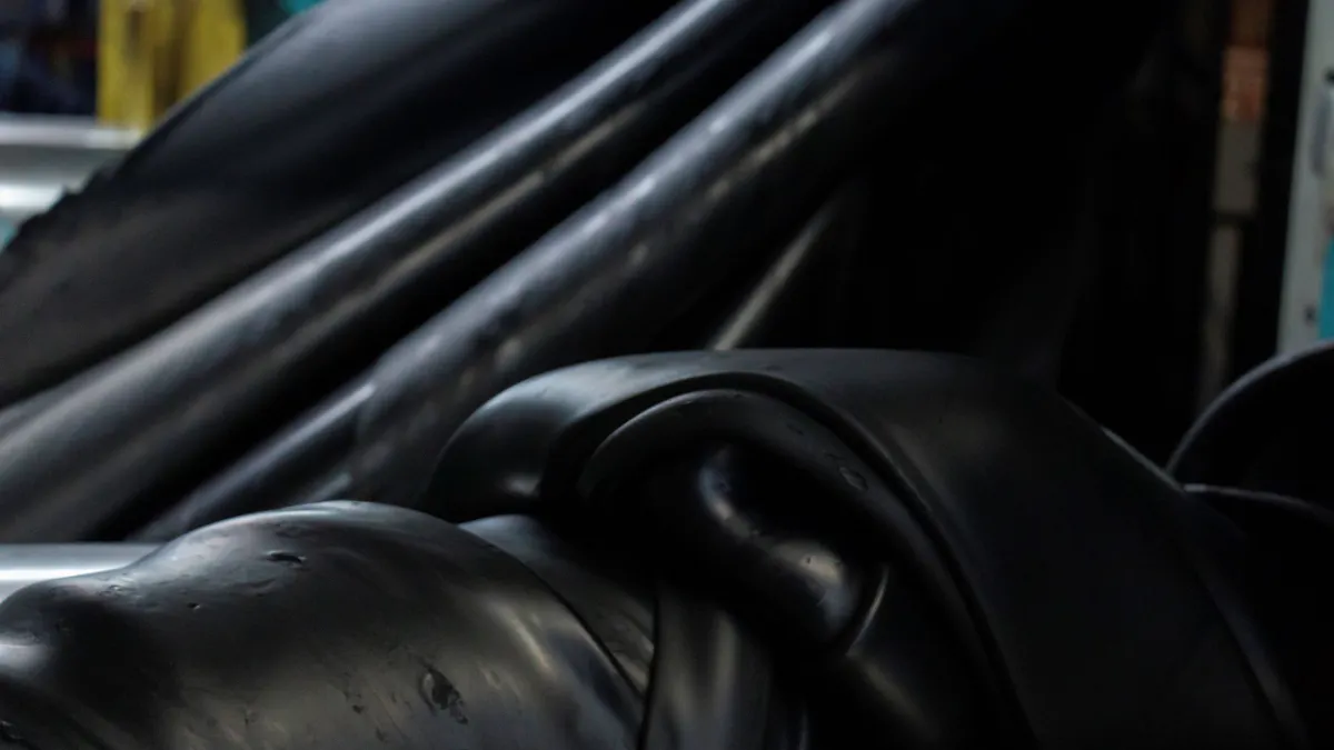 Black rubber being mixed at a factory.