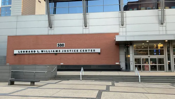 Exterior of a building with the words "Leonard L. Williams Justice Center"