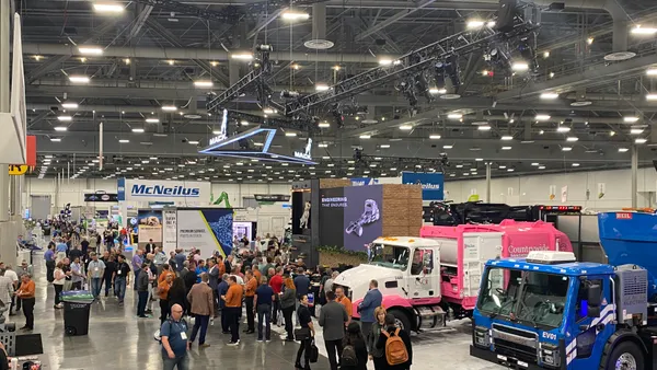 Aerial view of trucks, booths and people standing in the Las Vegas Convention Center at WasteExpo 2024