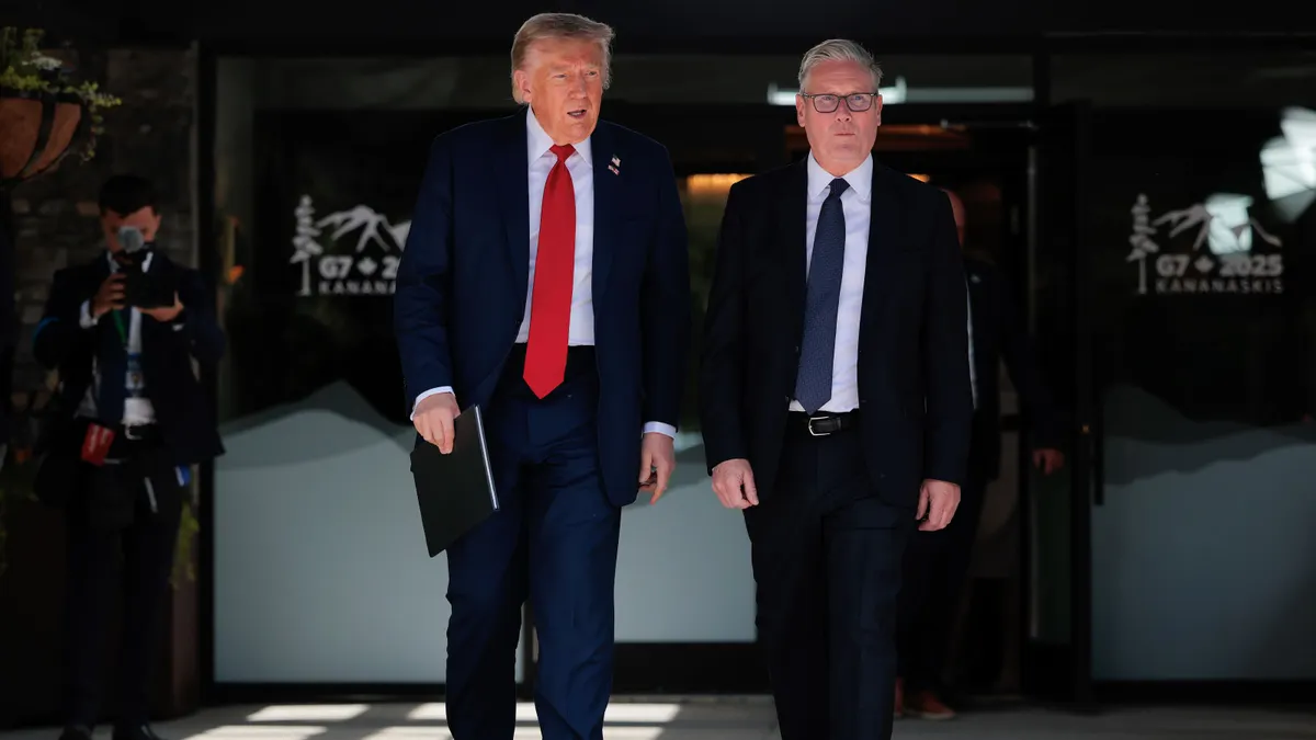 President Donald Trump walks alongside British Prime Minister Keir Starmar during the G7 Leaders' Summit on June 16, 2025, in Kananaskis, Alberta.