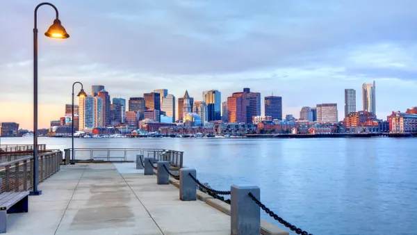 A large body of water with a city skyline in the background.