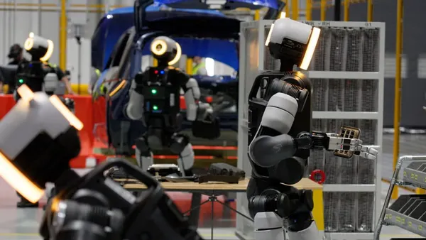 Boston Dynamics' Atlas humanoids conduct tasks at an automotive plant.
