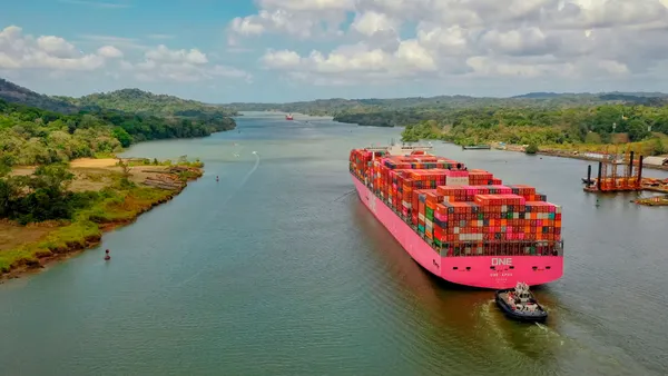 An ocean vessels transits a major waterway.
