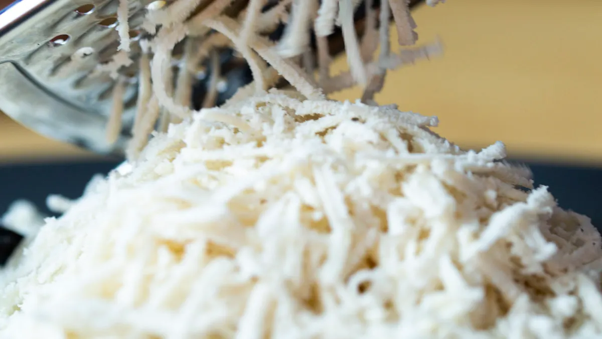 Animal-free mozzarella cheese from New Culture being grated.