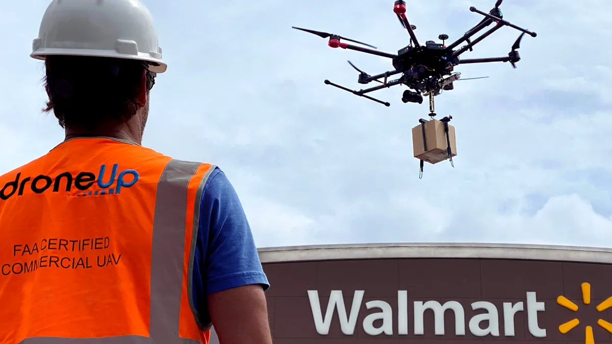 A DroneUp pilot overseeing drone delivery at Walmart store