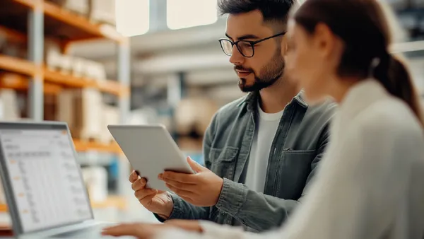 two people looking at computer