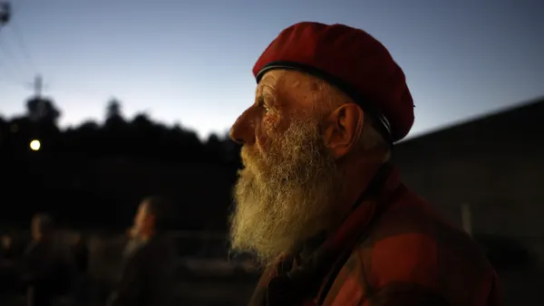 A person wearing a red beret.