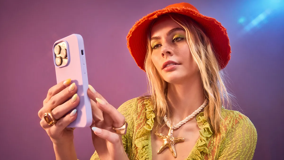 Girl in Orange Hat using Phone