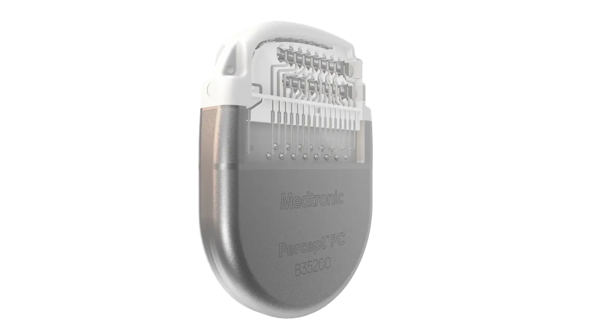 A rounded, metallic device says "Medtronic Percept PC"