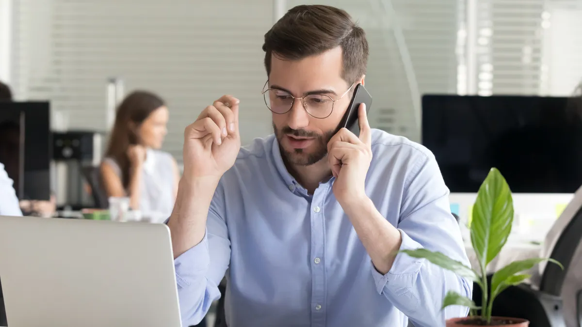 A person calls customer service on their cell phone