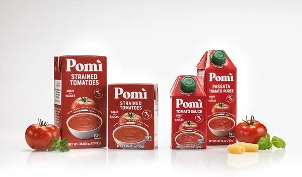 Four red cartons of Pomì tomato products.