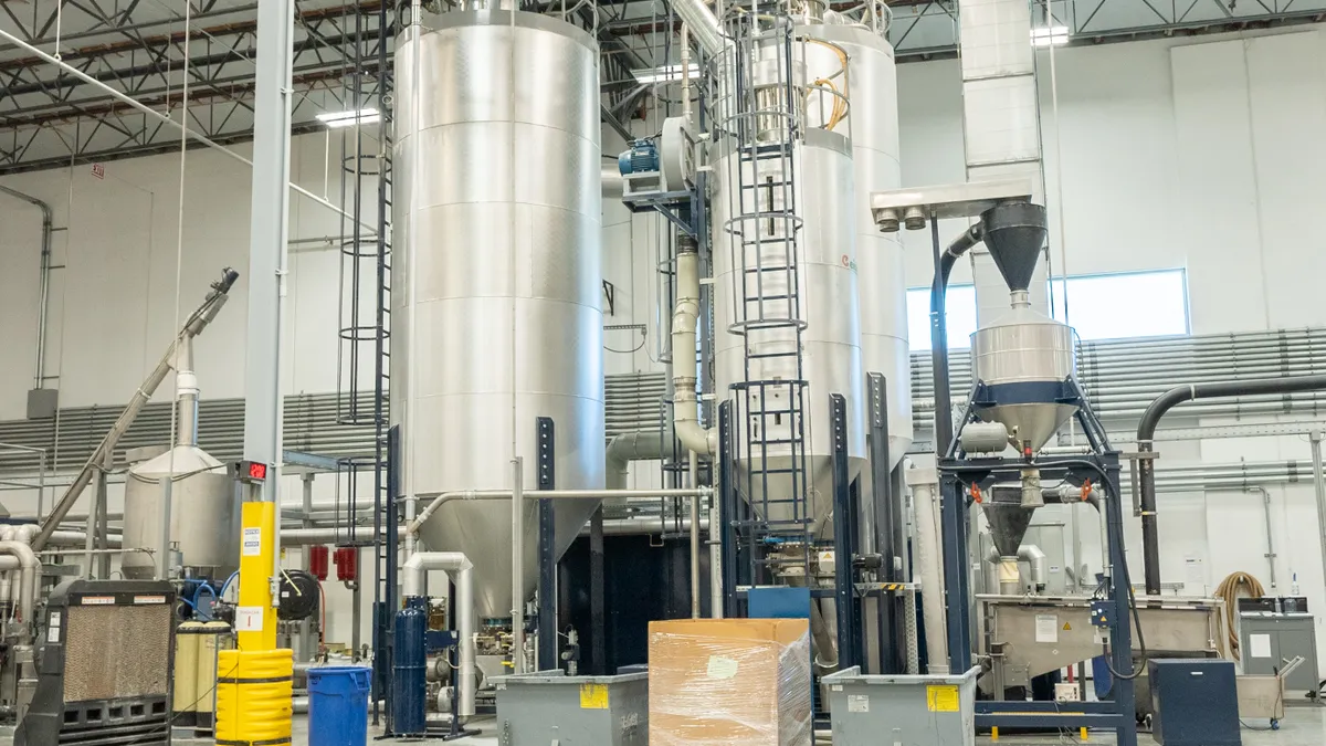 Industrial machinery at a recycled plastic production plant.