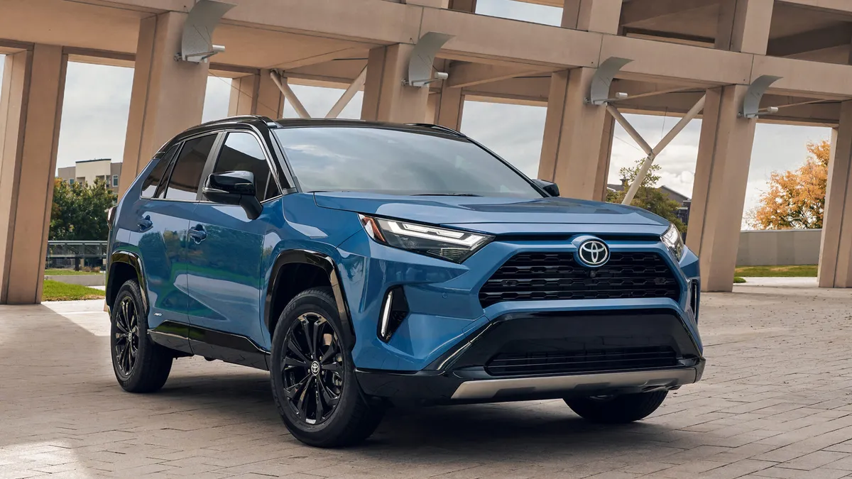 An exterior view of a blue 2025 Toyota RAV4 hybrid SUV.