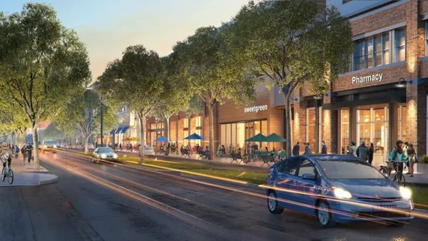 A rendering of brick buildings and trees. In the center building there is a logo that says sweetgreen