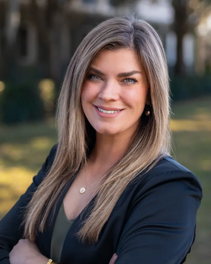 Headshot of a woman in business attire.