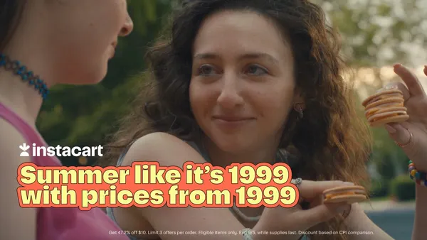 A person with curly hair holds up stacked crackers in an ad from Instacart